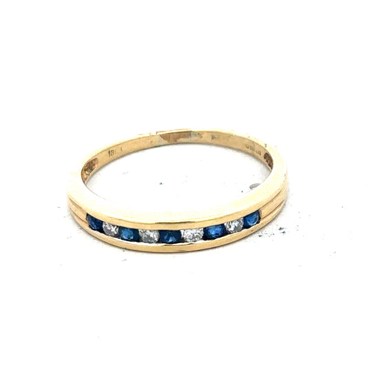 18ct yellow gold sapphire and diamond ring, size S, featuring a central sapphire gemstone with diamond accents.