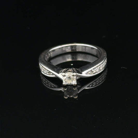 18ct white gold diamond ring with 1/3 carat round diamond, size J, featuring elegant craftsmanship and sparkling gemstone.