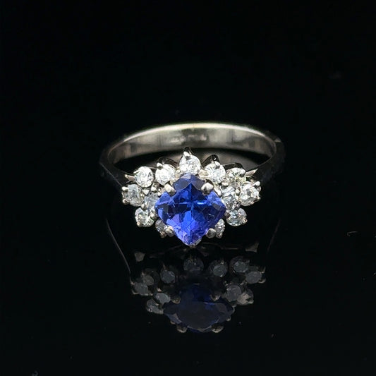 18ct white gold diamond and tanzanite ring, size O, featuring a central tanzanite gemstone surrounded by sparkling diamonds.