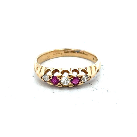 18ct yellow gold diamond and ruby ring, size N, featuring sparkling gemstones and a sleek band design.