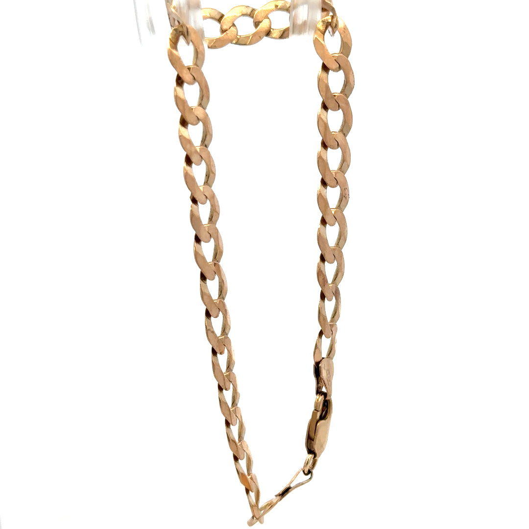 9ct yellow gold curb bracelet with a polished finish, weighing 7.7g, featuring linked oval chains, crafted by Reeves and Sons.