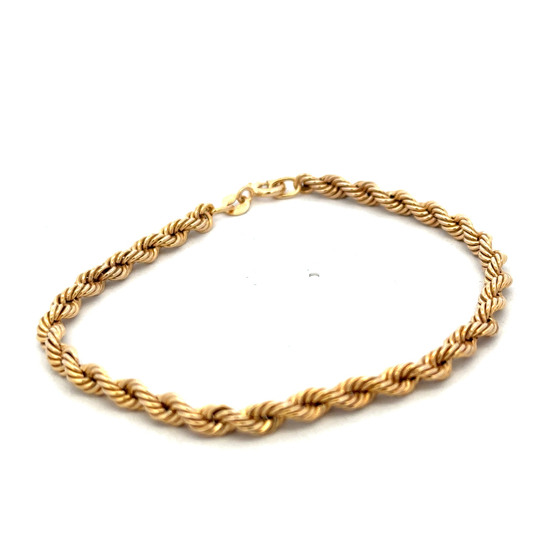 9ct yellow gold rope bracelet weighing 2.4g, featuring a twisted design, crafted by Reeves and Sons.