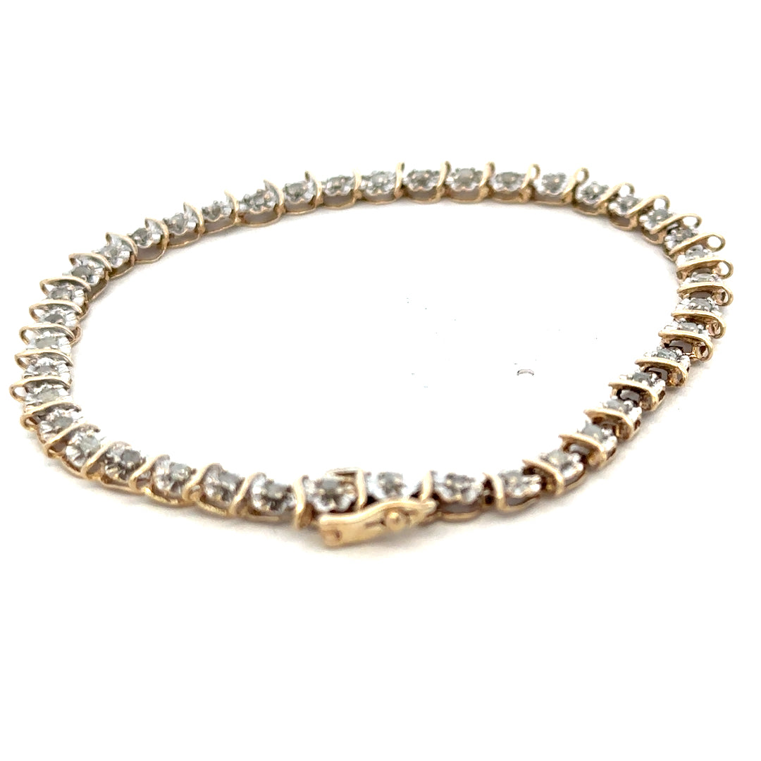 9ct yellow gold diamond bracelet with intricate links, weighing 5.9g, from Reeves and Sons, displayed on a neutral background.