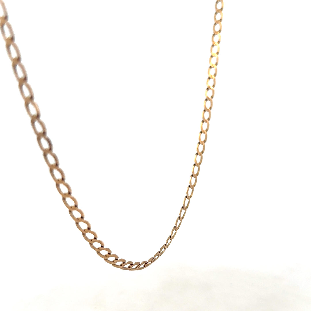 9ct yellow gold curb chain weighing 7.6g, featuring interlinked oval links, displayed on a neutral background.