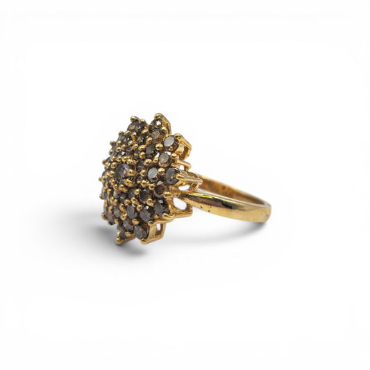 9ct yellow gold diamond cluster ring by Reeves and Sons, featuring a sparkling diamond cluster design.
