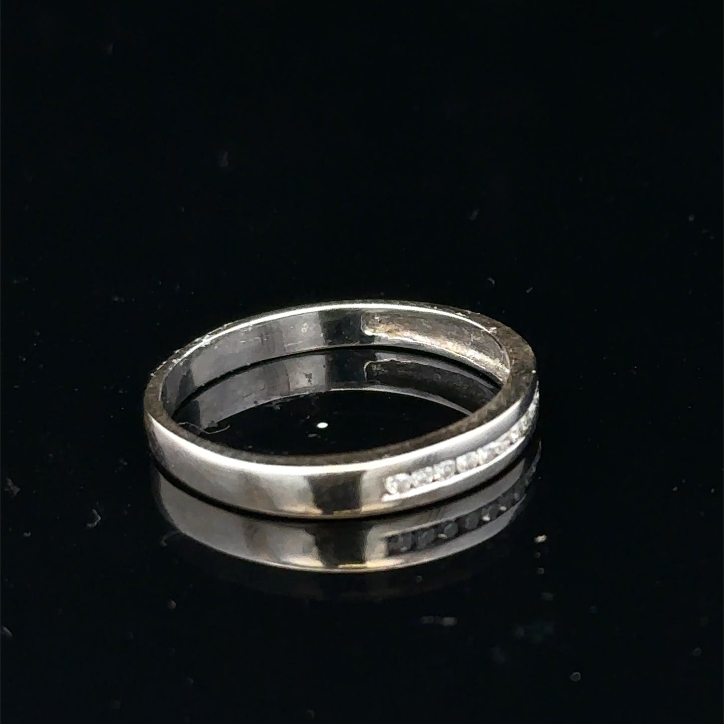 18ct white gold diamond half eternity ring with sparkling diamonds, crafted by Reeves and Sons.