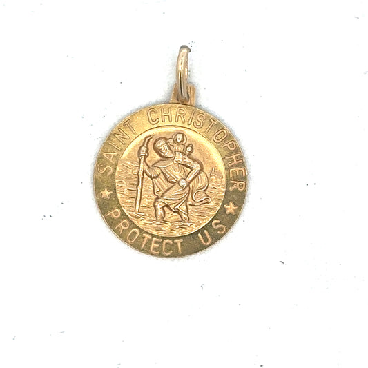 9ct yellow gold St Christopher pendant by Reeves and Sons, showing intricate religious design on a polished gold surface.