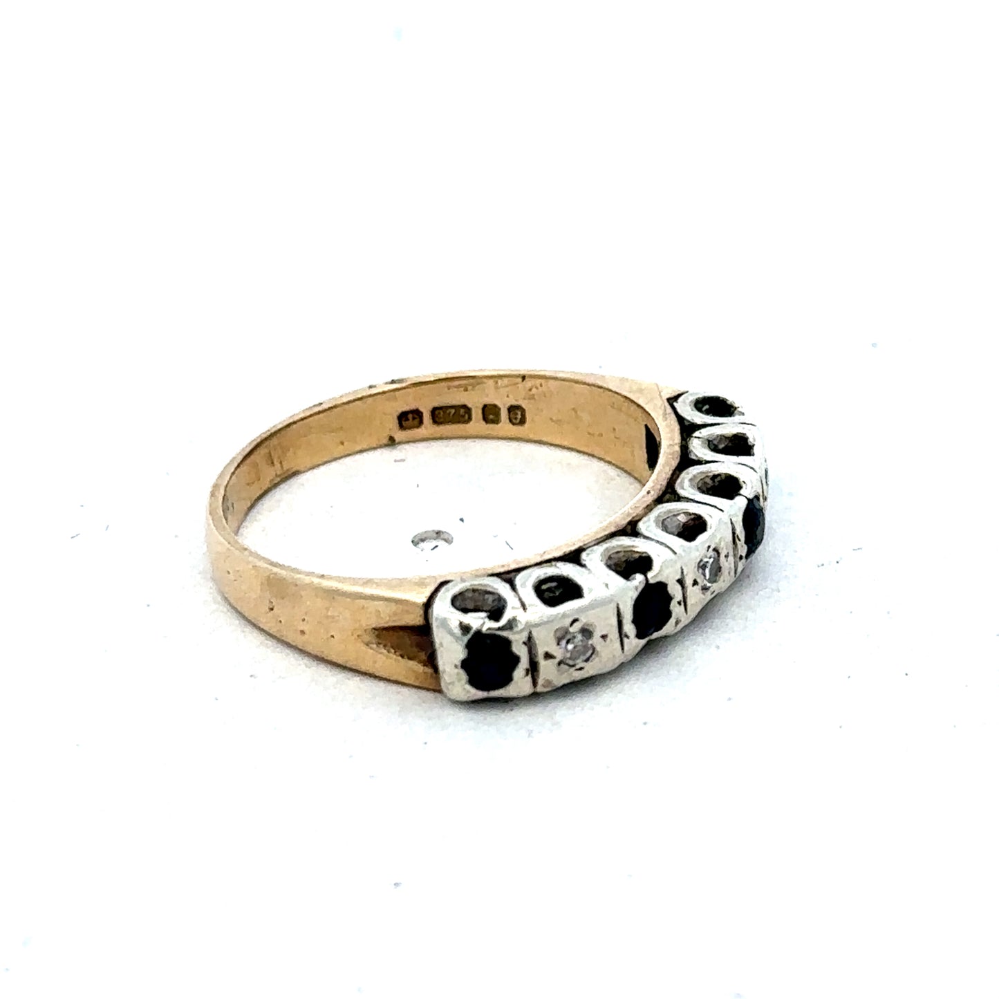 9ct yellow gold sapphire and diamond ring, size K, featuring a central sapphire gemstone surrounded by sparkling diamonds.