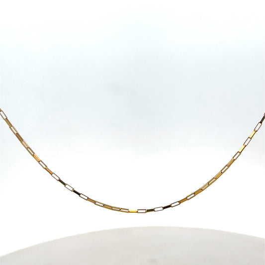 9ct yellow gold chain from Reeves and Sons, weighing 1.8g, with a delicate link design, shown in a close-up image.