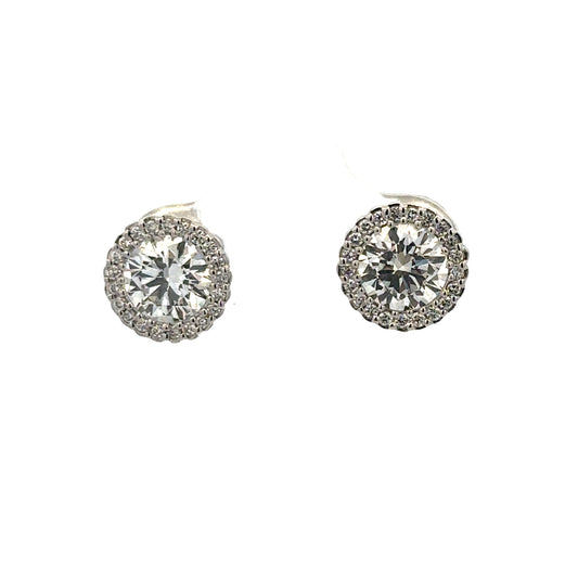 18ct white gold lab-grown diamond stud earrings by Reeves and Sons, showcasing sparkling diamonds on sleek gold settings.