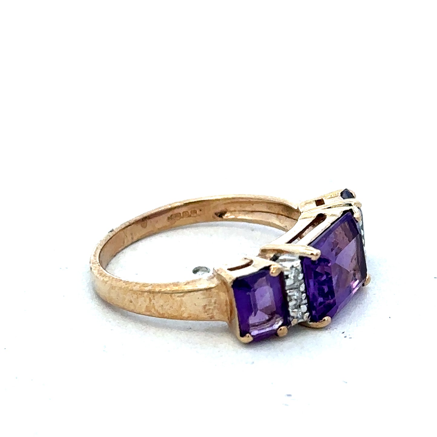 9ct yellow gold amethyst and diamond ring, size N, featuring a central amethyst gemstone with diamond accents, by Reeves and Sons