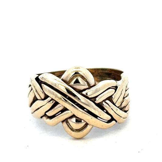 9ct yellow gold puzzle ring in size U by Reeves and Sons, featuring intricate interlocking design.