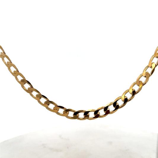 9ct yellow gold curb chain weighing 27.7g, featuring a classic linked design by Reeves and Sons.