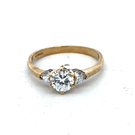 9ct yellow gold CZ ring size U by Reeves and Sons, featuring a sparkling cubic zirconia gemstone in a classic band design.
