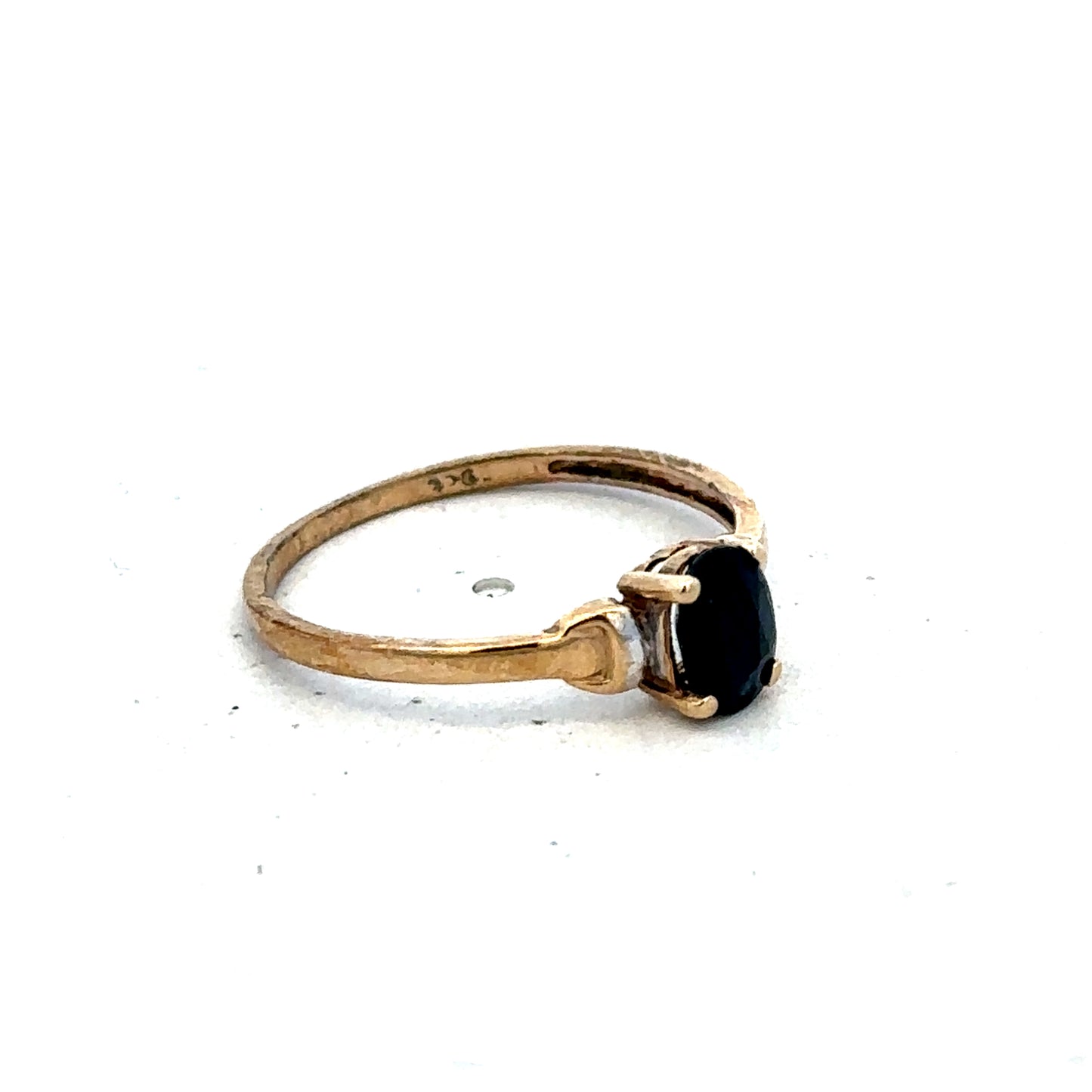 9ct yellow gold ring in size M by Reeves and Sons, showcasing a smooth, polished band with a classic design.
