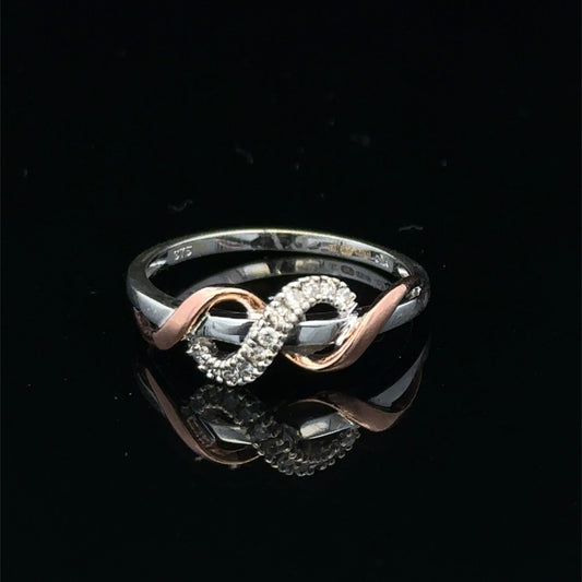 9ct white gold diamond ring in size M with sparkling diamonds, featuring a sleek design from Reeves and Sons.