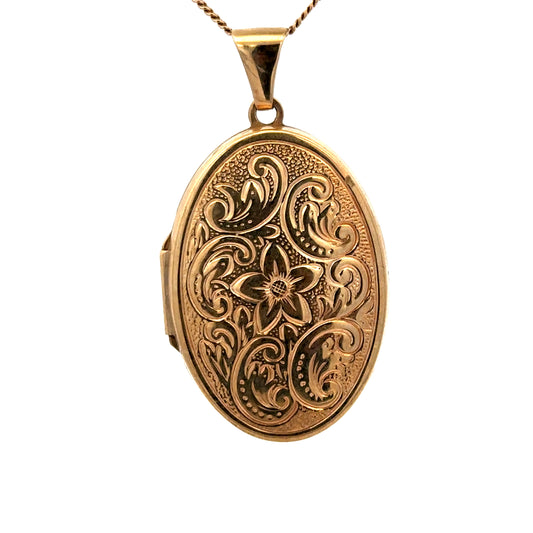 9ct yellow gold locket pendant by Reeves and Sons, showcasing a detailed design, weighs 4.4g, with a polished finish.