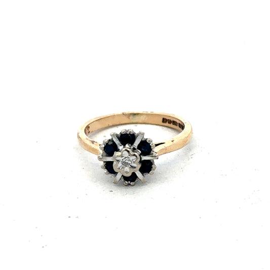 9ct yellow gold ring in size J by Reeves and Sons, showcasing a smooth polished band.