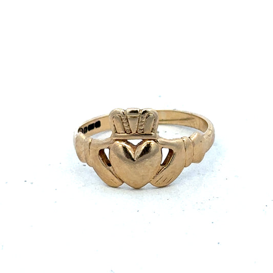 9ct yellow gold Claddagh ring in size Q by Reeves and Sons, featuring intricate heart and crown design.