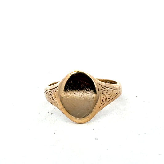 9ct yellow gold signet ring in size P by Reeves and Sons, showcasing a smooth, polished surface and classic design.