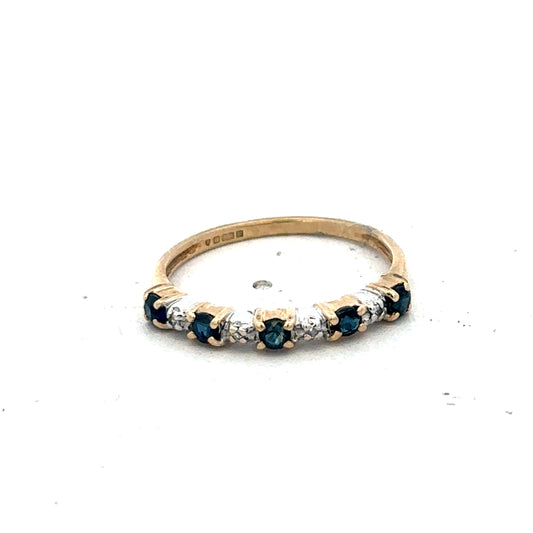 9ct yellow gold sapphire and diamond ring in size M featuring a central sapphire and sparkling diamonds, crafted by Reeves and Sons.