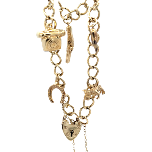 9ct yellow gold charm bracelet with intricate chain links, weighing 20.4g, crafted by Reeves and Sons.