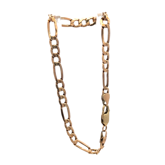 9ct yellow gold figaro bracelet by Reeves and Sons, showcasing linked chain design with a polished finish.