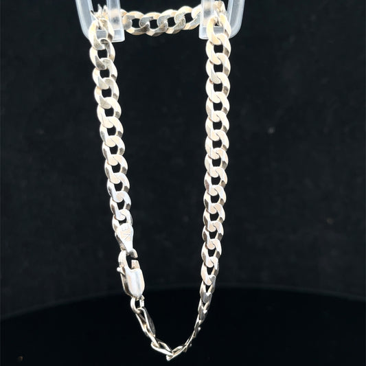 Silver curb bracelet by Reeves and Sons, 5.1g, featuring interlinked flat silver chains, shown in close-up detail.