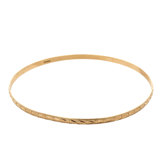 9ct yellow gold bangle by Reeves and Sons, lightweight jewelry piece weighing 4.2g, with a smooth, polished finish.