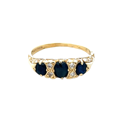 18ct sapphire and diamond ring in size M by Reeves and Sons, featuring a central sapphire gemstone with surrounding diamonds.