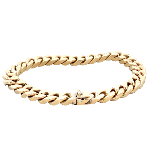 9ct yellow gold curb bracelet by Reeves and Sons, 53.4g, featuring interlocking polished links