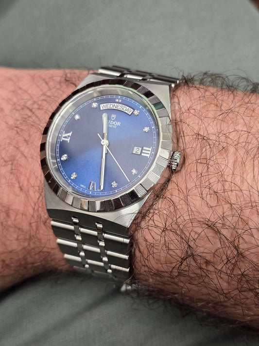 Reeves and Sons Tutor Royal Day Date Diamond Watch Model 28600 with diamond accents and stainless steel band, 2021.