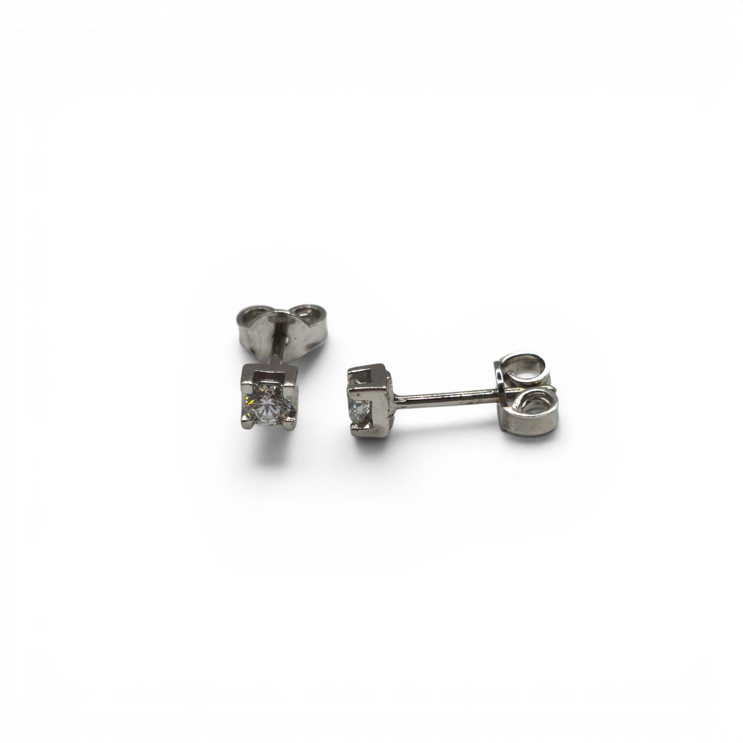 18ct white gold diamond stud earrings by Reeves and Sons featuring sparkling diamond accents on classic studs.