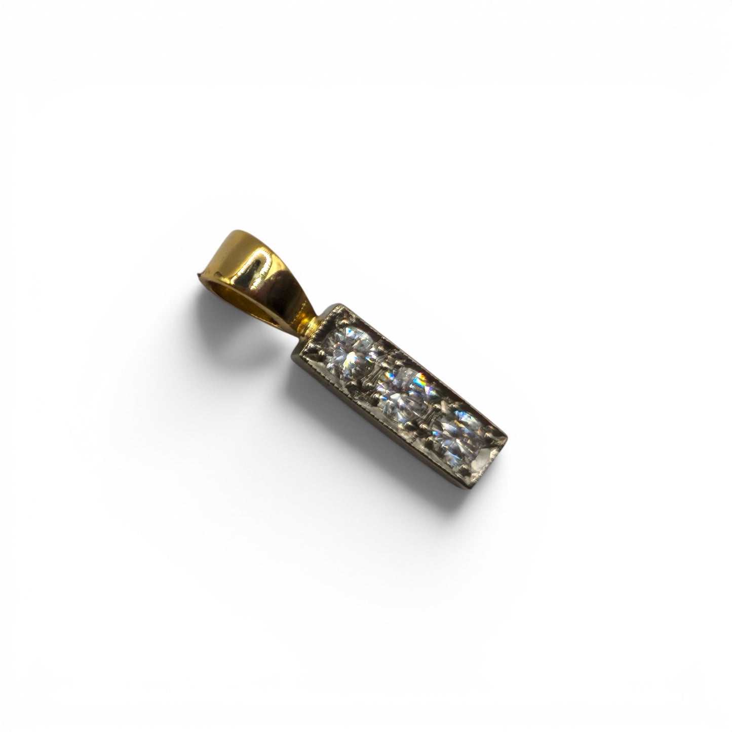 18ct yellow gold diamond three-stone pendant by Reeves and Sons featuring sparkling diamonds and elegant design.