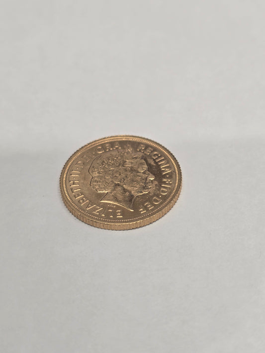 2012 Reeves and Sons full sovereign coin with detailed portrait and intricate design on a reflective surface