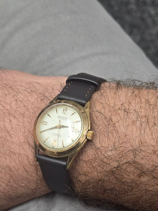 Vintage Reeves and Sons Ramona 30 Jewels Incabloc automatic Swiss watch with a classic dial and stainless steel case.
