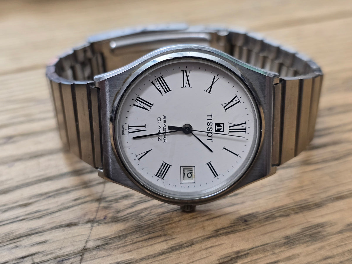 Vintage Tissot Seastar Quartz Stainless Steel White Dial Roman Numeral Date Watch