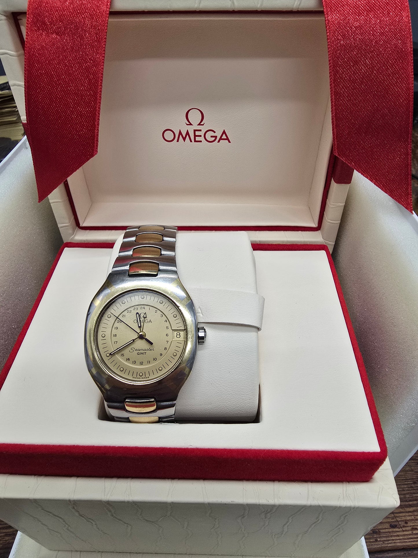 Vintage Omega Seamaster Polaris Chronograph watch with steel and gold bracelet, 1980s quartz model displaying a classic dial.