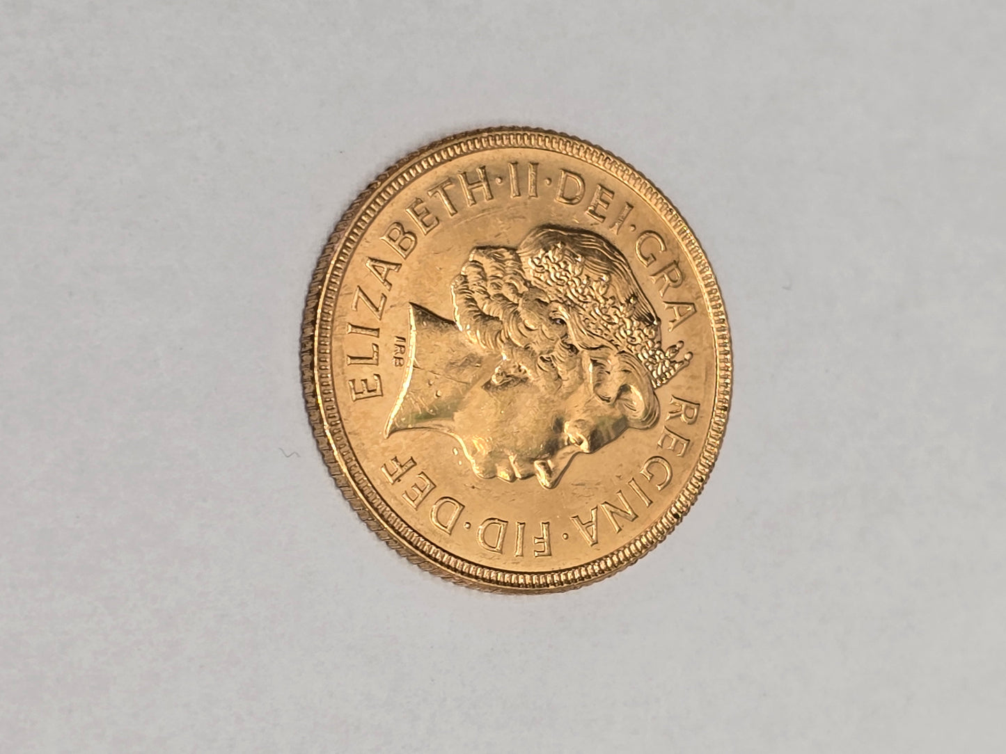 2001 Reeves and Sons full sovereign coin showing detailed portrait and inscriptions on the front side.