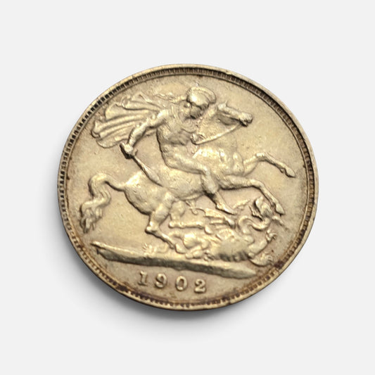 Gold sovereign coin featuring St. George and the Dragon design, 1902 Edward VII coin by Reeves and Sons.