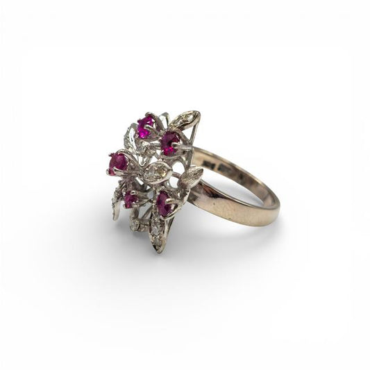 14ct white gold ruby and diamond ring with a central ruby gemstone and sparkling diamonds for elegant jewelry.