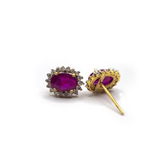 18ct ruby and diamond earrings featuring sparkling gemstones and silver setting, elegant jewelry for special occasions.