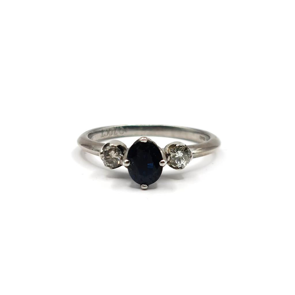 18ct white gold sapphire ring featuring a 0.70 carat central sapphire and surrounding 0.30 carat sapphires, elegant jewelry piece.