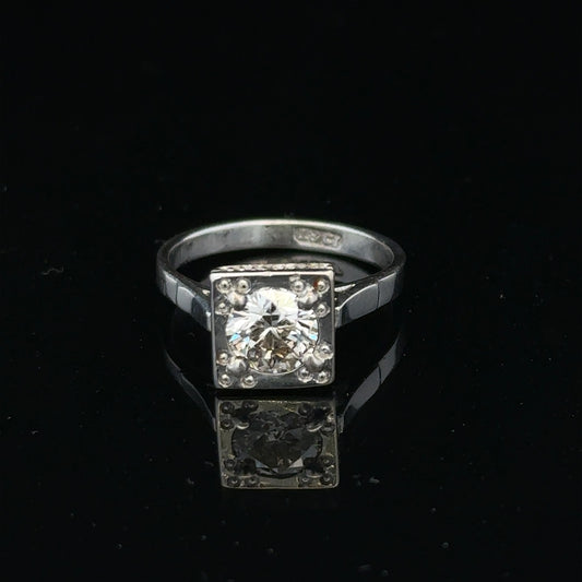 18ct white gold diamond ring with 0.89ct diamonds, size L, featuring a sleek band and elegant sparkle.