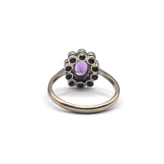 18ct white gold ring with a 1.00 carat amethyst and 0.30 carat diamonds, size P1/2, featuring a detailed gemstone setting.