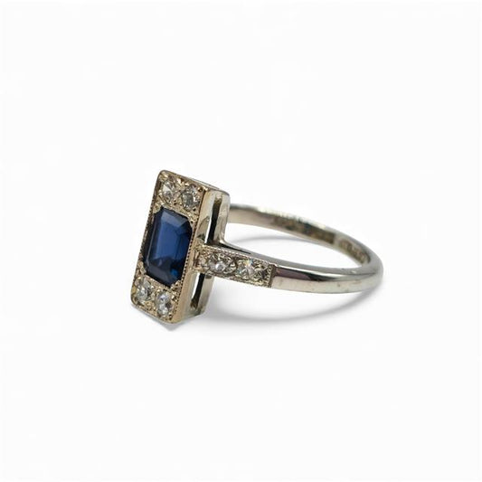 18ct white gold and platinum diamond and sapphire ring, featuring sparkling gemstones and intricate band design.