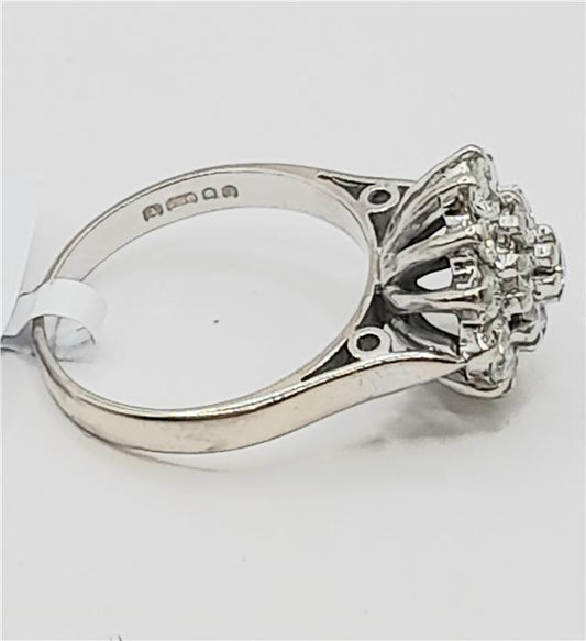 18ct white gold diamond cluster ring in size L with sparkling diamonds, showcasing an elegant and sophisticated jewelry design.