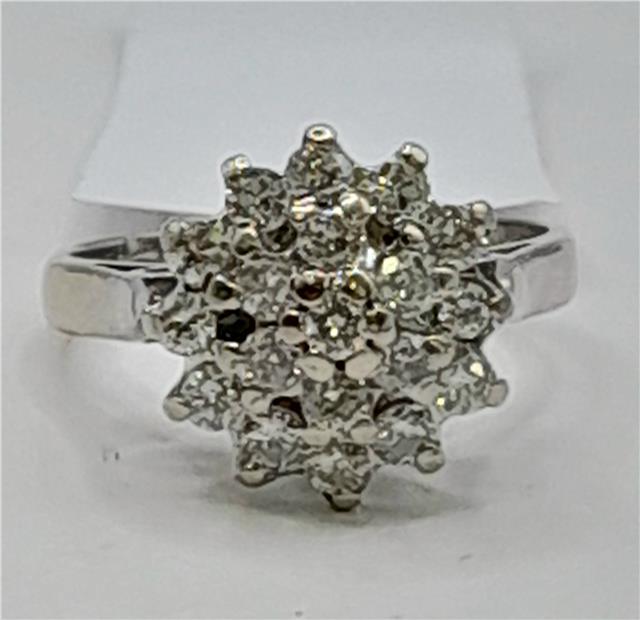18ct white gold diamond cluster ring in size L, featuring a sparkling diamond design and elegant craftsmanship.