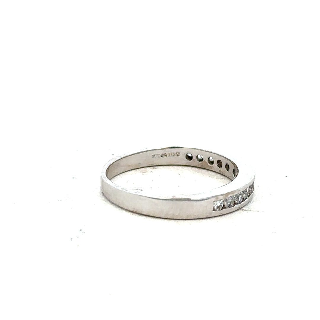 18ct white gold diamond ring in size J featuring sparkling diamonds, elegant jewelry piece with a sleek design