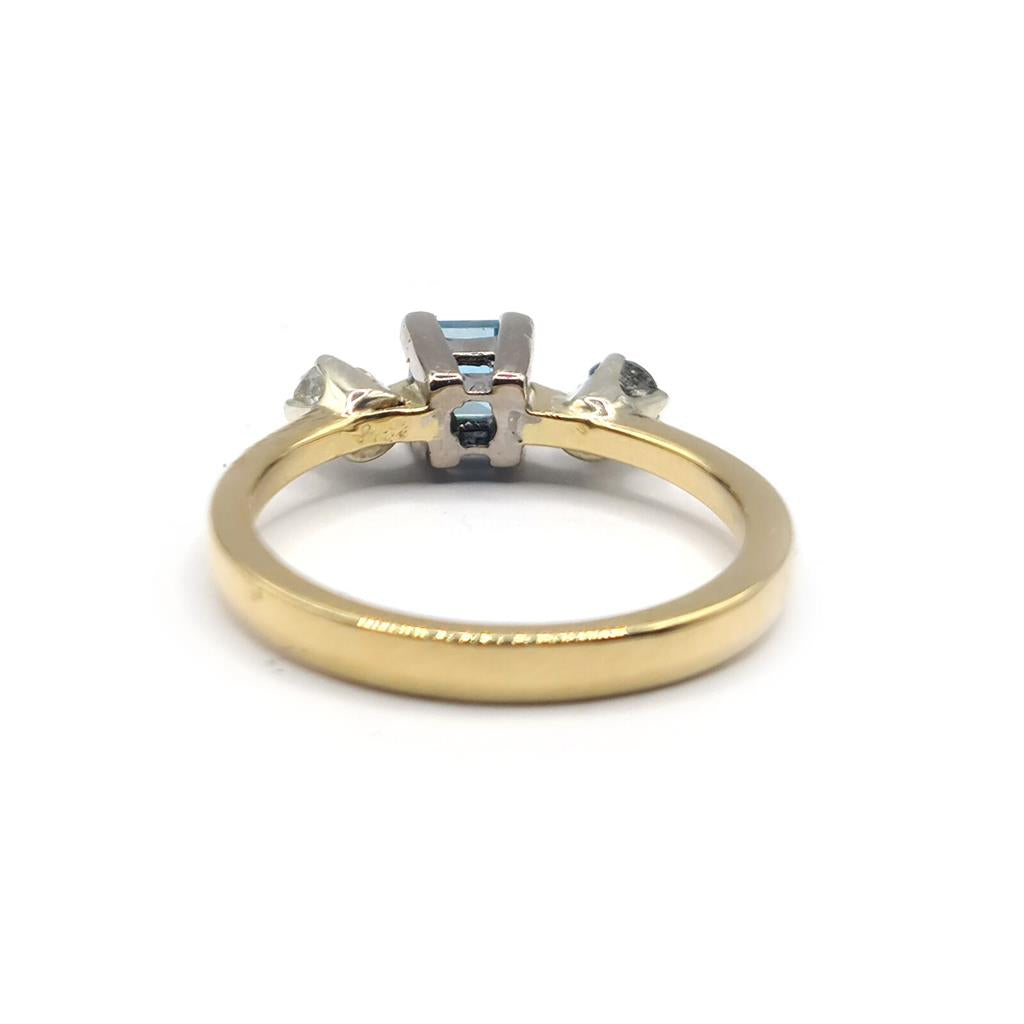 18ct yellow gold ring featuring a 0.35 carat topaz and 0.14 carat diamond accent, elegant jewelry piece.